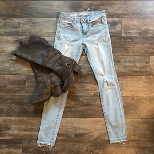 Bundle of a pair of boots and jeans.